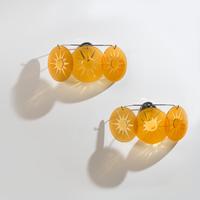 Group of Four Amber Glass Three-Light Wall Sconces