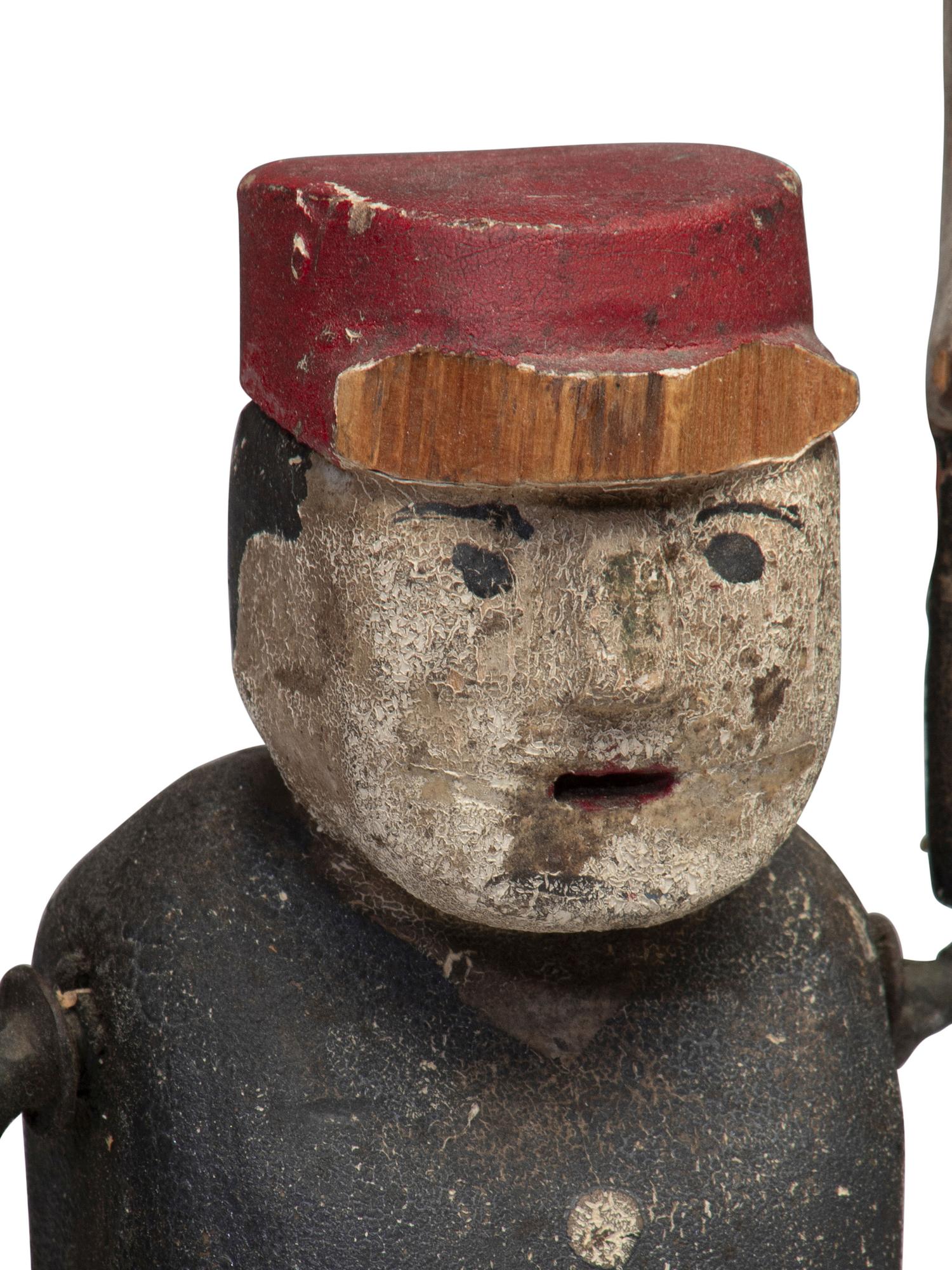 A Carved and Painted Wood Whirligig