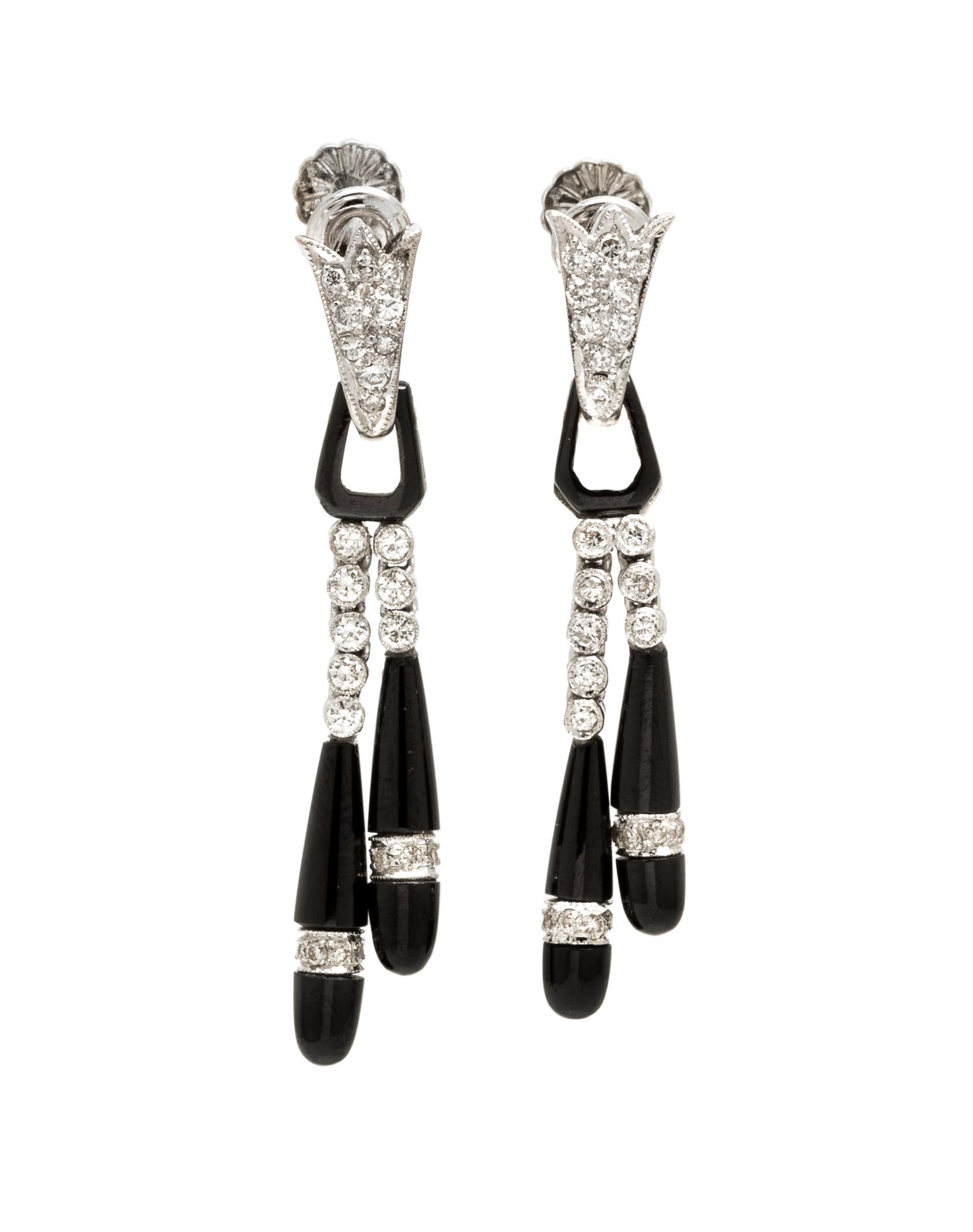 A Pair of Platinum, Onyx and Diamond Earclips, 4.00 dwts.