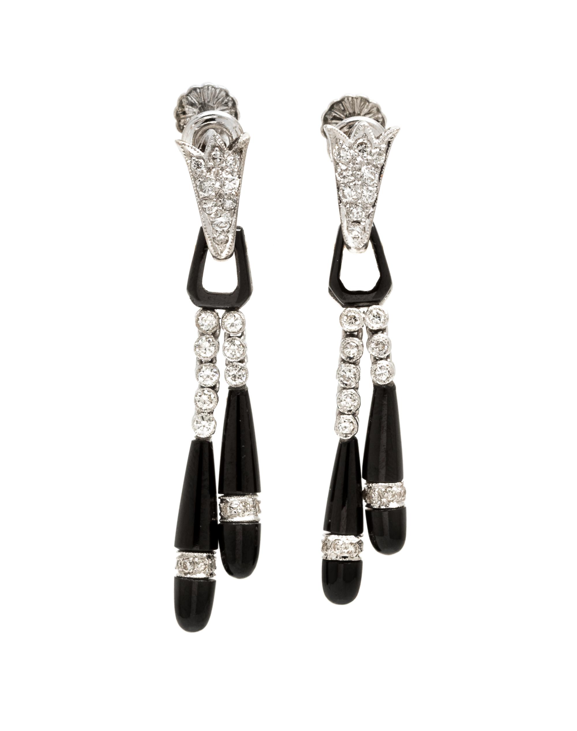 A Pair of Platinum, Onyx and Diamond Earclips, 4.00 dwts.