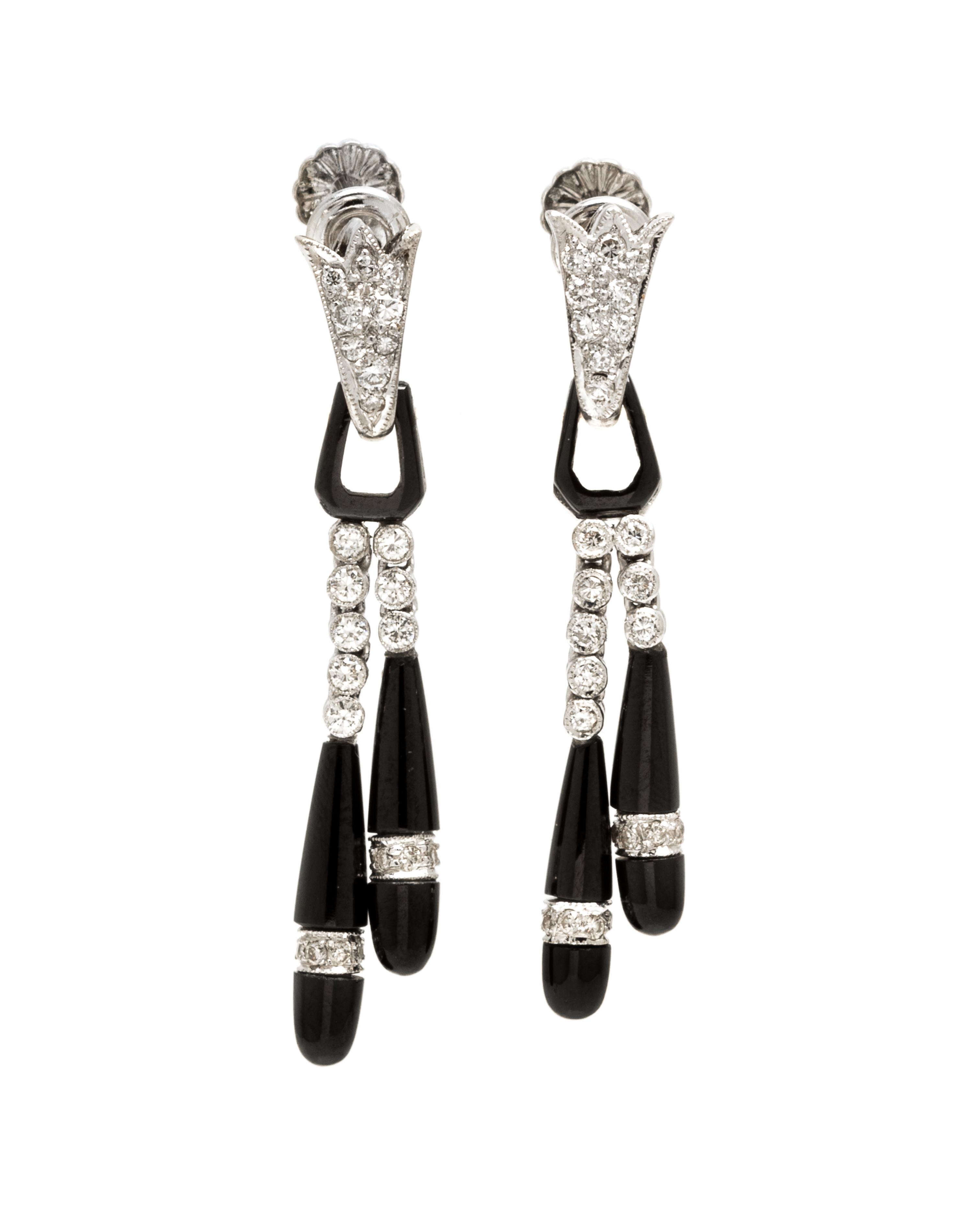 A Pair of Platinum, Onyx and Diamond Earclips, 4.00 dwts.