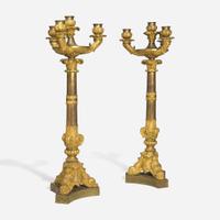 A pair of large French Louis Philippe ormolu candlesticks circa 1830-1840