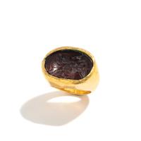 A Greek Gold and Garnet Finger Ring with the Goddess Isis
