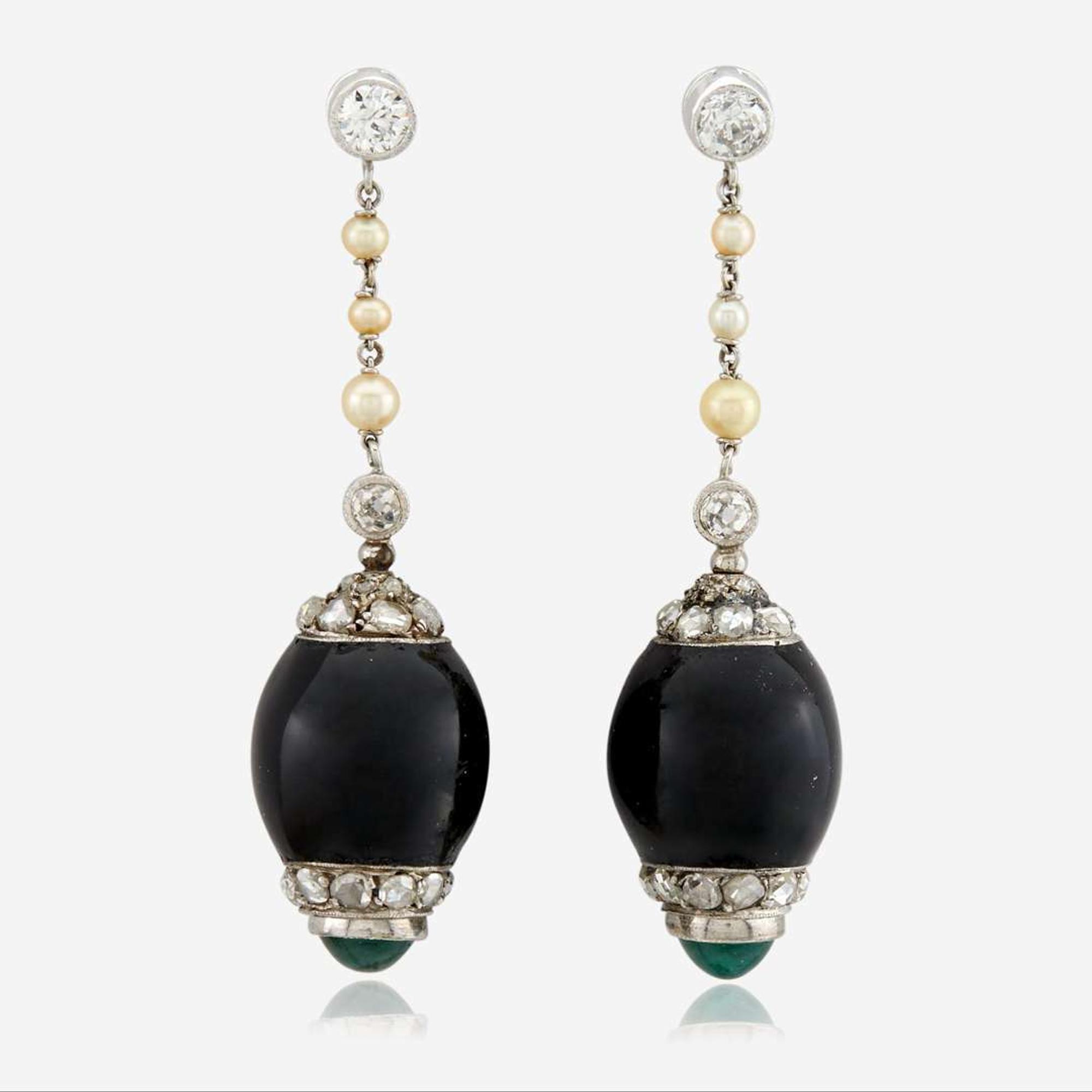 A pair of onyx, diamond, pearl, emerald, and white gold ear pendants