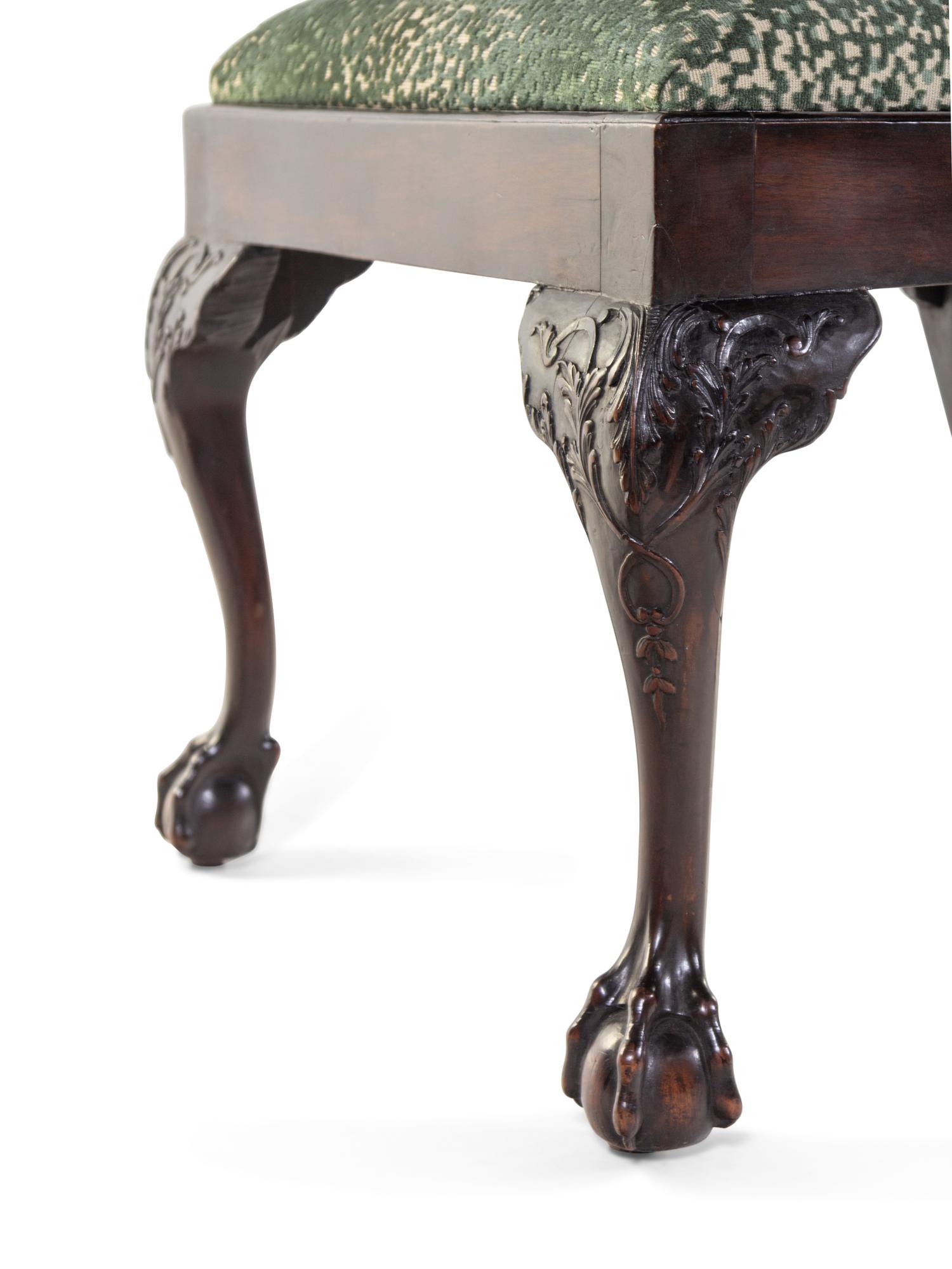 A Set of Eight George III Style Carved Mahogany Ribbon-Back Dining Chairs