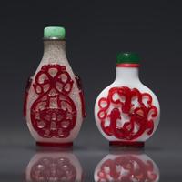Two Chinese Ruby Overlay Glass Snuff Bottles, Qing Dynasty, 18th/19th Century — 清中期 套寶石紅料鼻煙壺兩支
