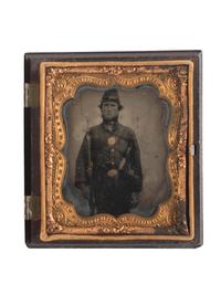 [CIVIL WAR]. Sixth plate ruby ambrotype of heavily armed Union soldier.