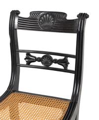 A Set of Four Regency Shell Carved Ebony Side Chairs
