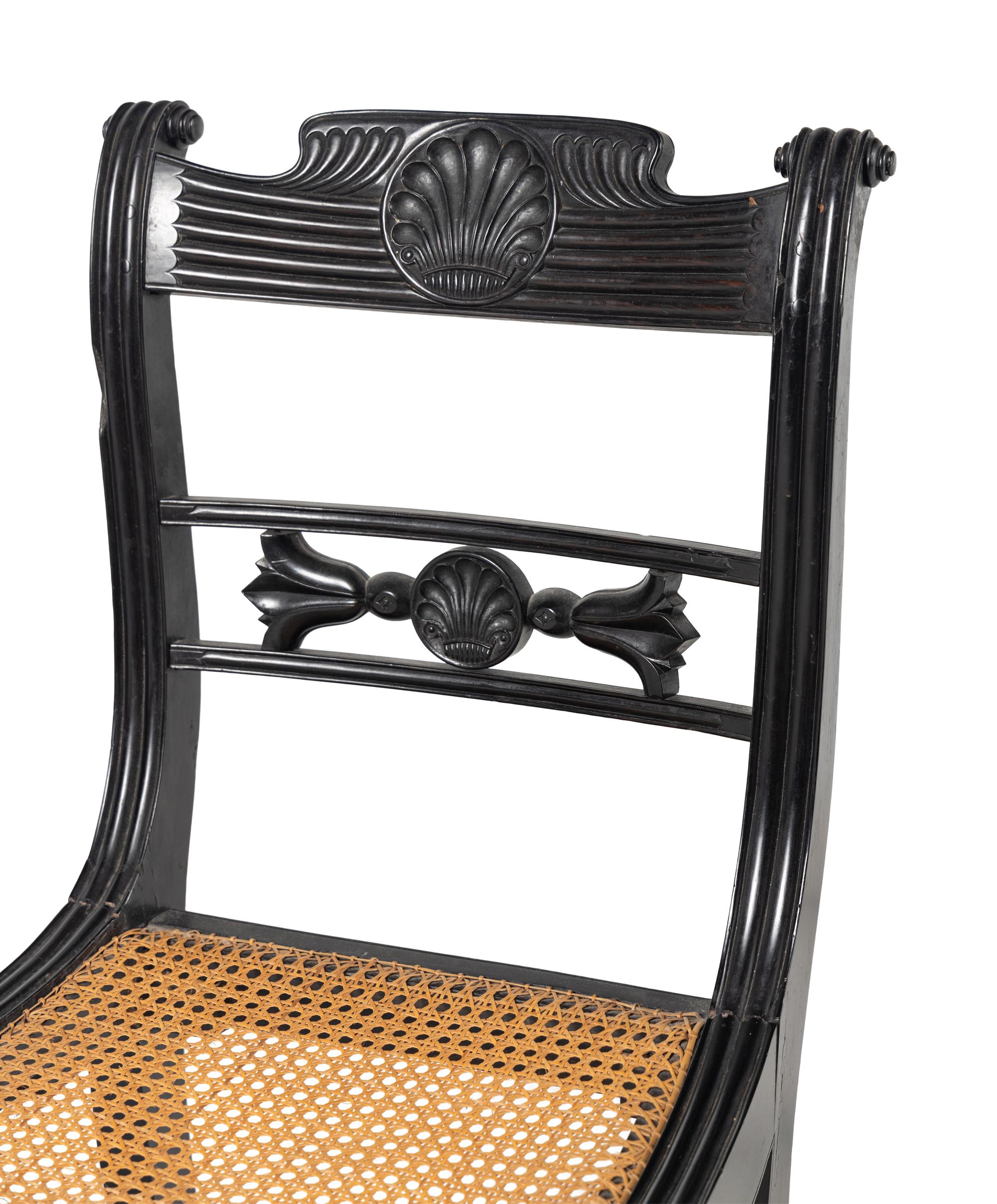 A Set of Four Regency Shell Carved Ebony Side Chairs