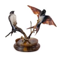 A Carved Figural Group of Two Birds