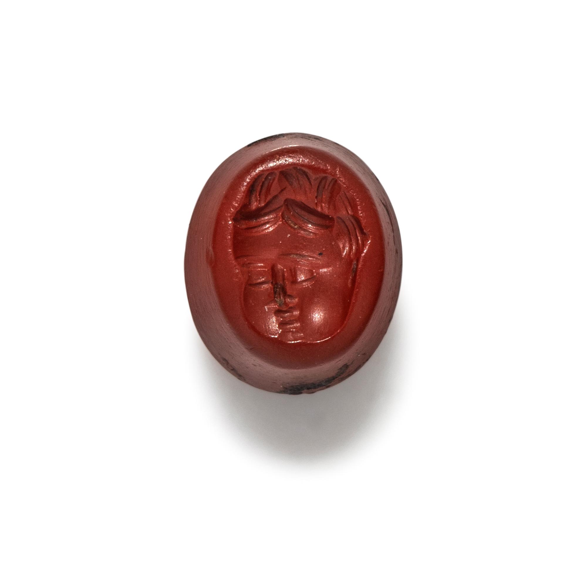 A Roman Red Jasper Ring Stone with the Head of a Baby