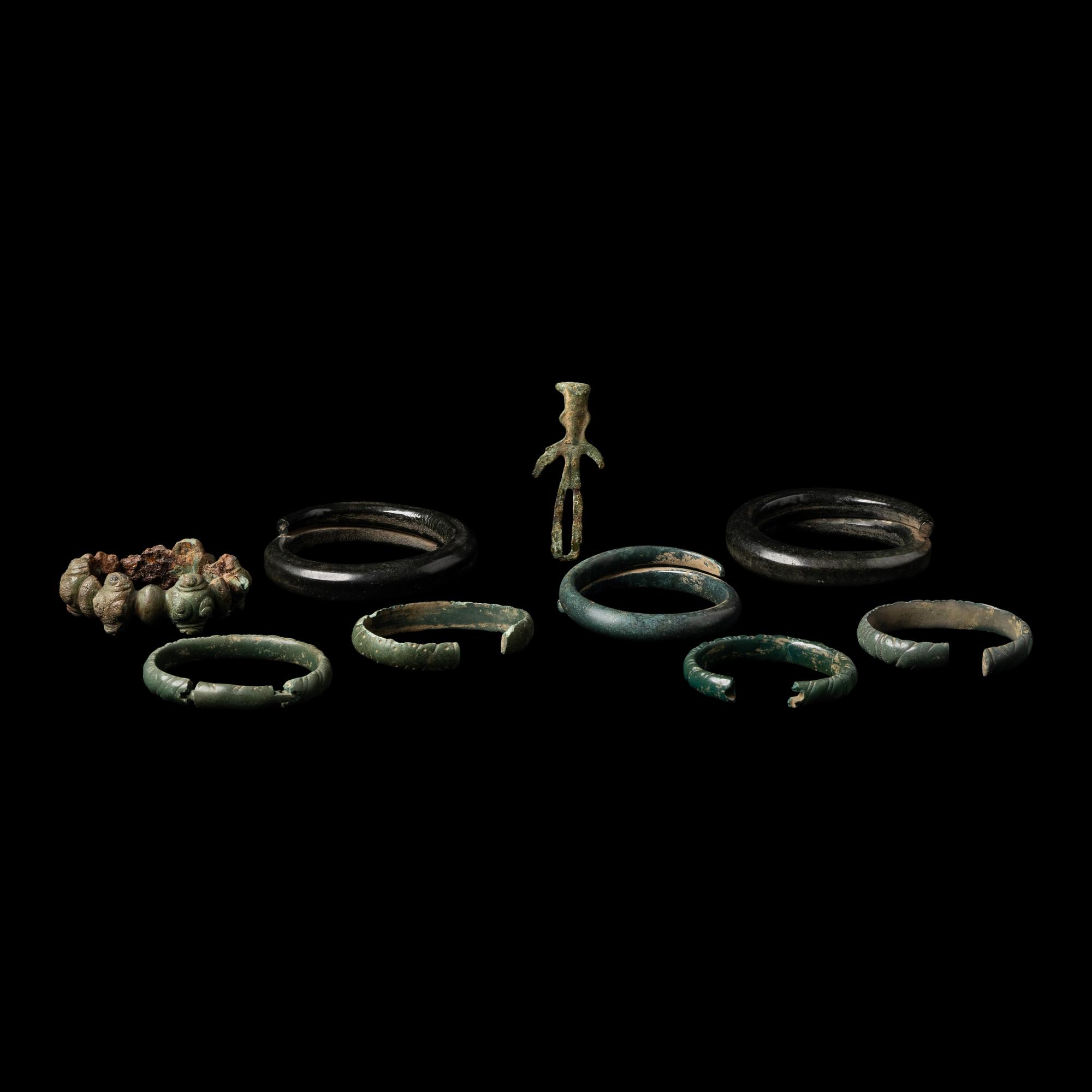Eight European Bronze Armlets, Bracelets and a Figure