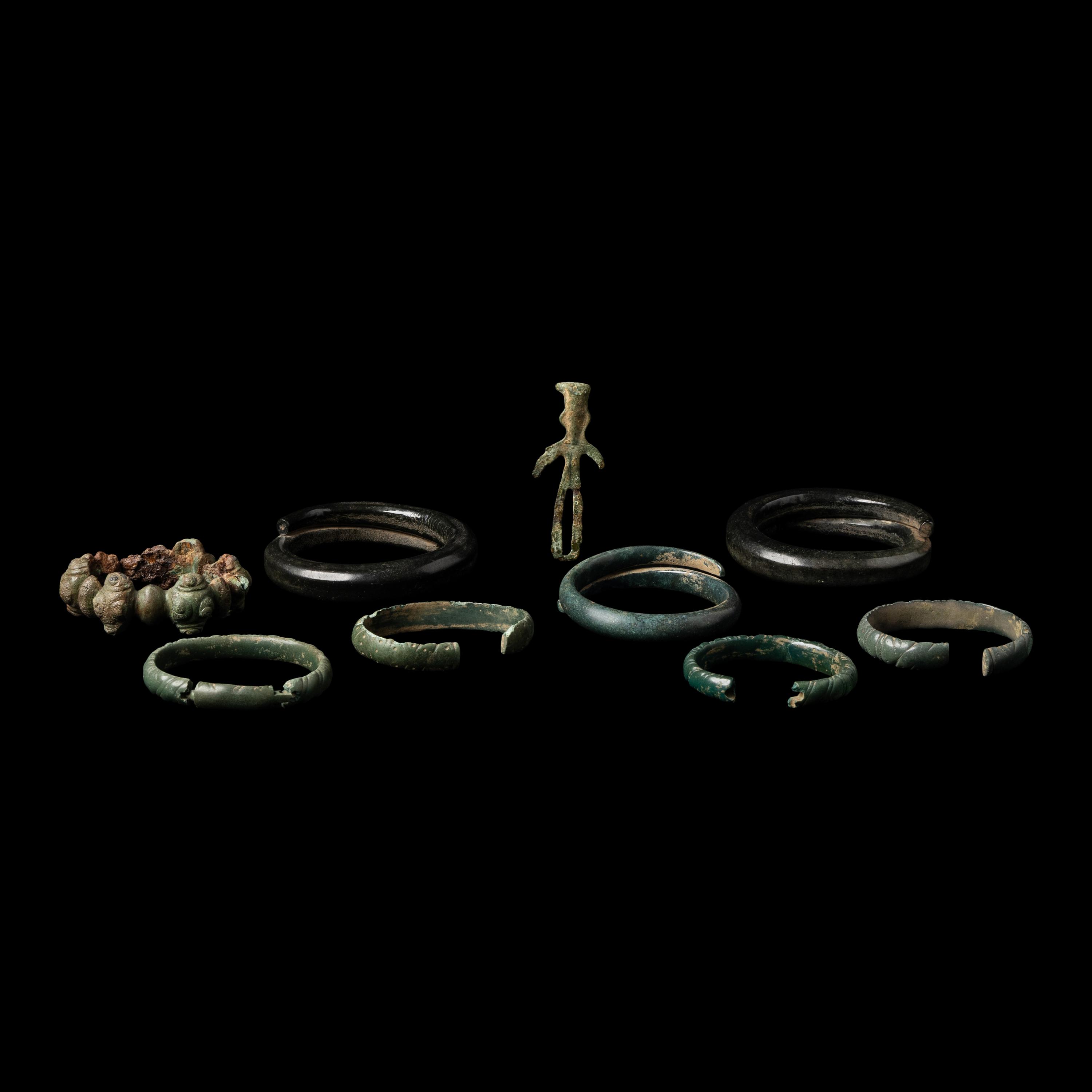 Eight European Bronze Armlets, Bracelets and a Figure