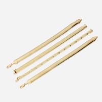 A collection of four fourteen karat gold bracelets