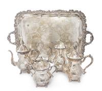 An American Cast Metal Tea Service, Rogers Brothers, Waterbury, CT, comprising two teapots, coffee pot, covered sugar and tray.