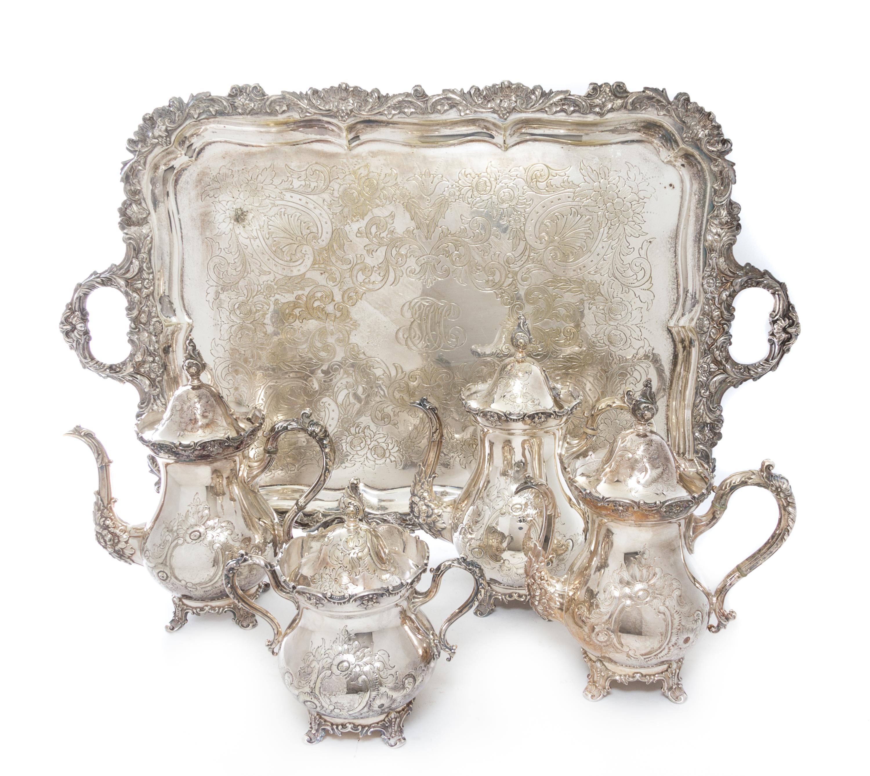 An American Cast Metal Tea Service, Rogers Brothers, Waterbury, CT, comprising two teapots, coffee pot, covered sugar and tray.