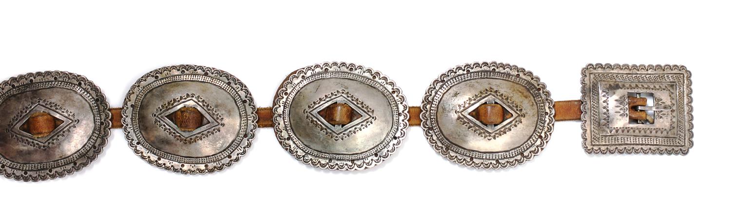 A Navajo First Phase Style Silver Concha Belt Length overall 38 1/2 inches; concha 3 x 3/4 inches; buckle 2 1/2 x 3 1/4 inches. — LATE 19TH/EARLY 20TH CENTURY