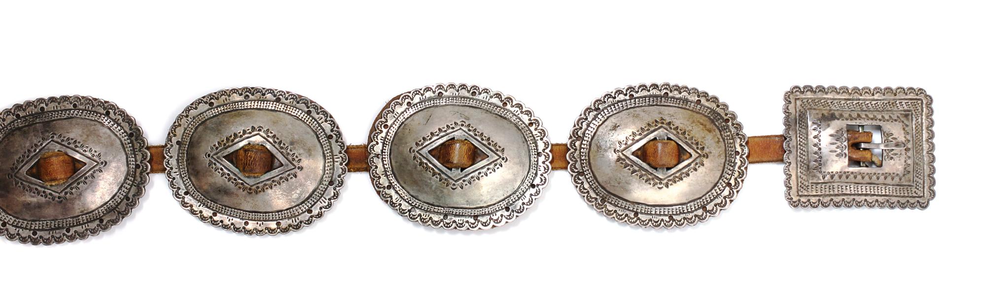 A Navajo First Phase Style Silver Concha Belt Length overall 38 1/2 inches; concha 3 x 3/4 inches; buckle 2 1/2 x 3 1/4 inches. — LATE 19TH/EARLY 20TH CENTURY