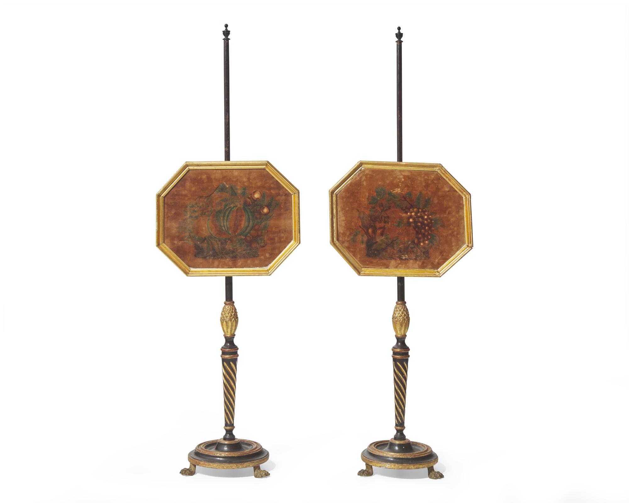 A pair of Regency ebonized and parcel-gilt firescreens with painted velvet theorem panels, circa 1820