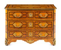 A Régence Style Gilt Metal Mounted Burl Walnut Chest of Drawers