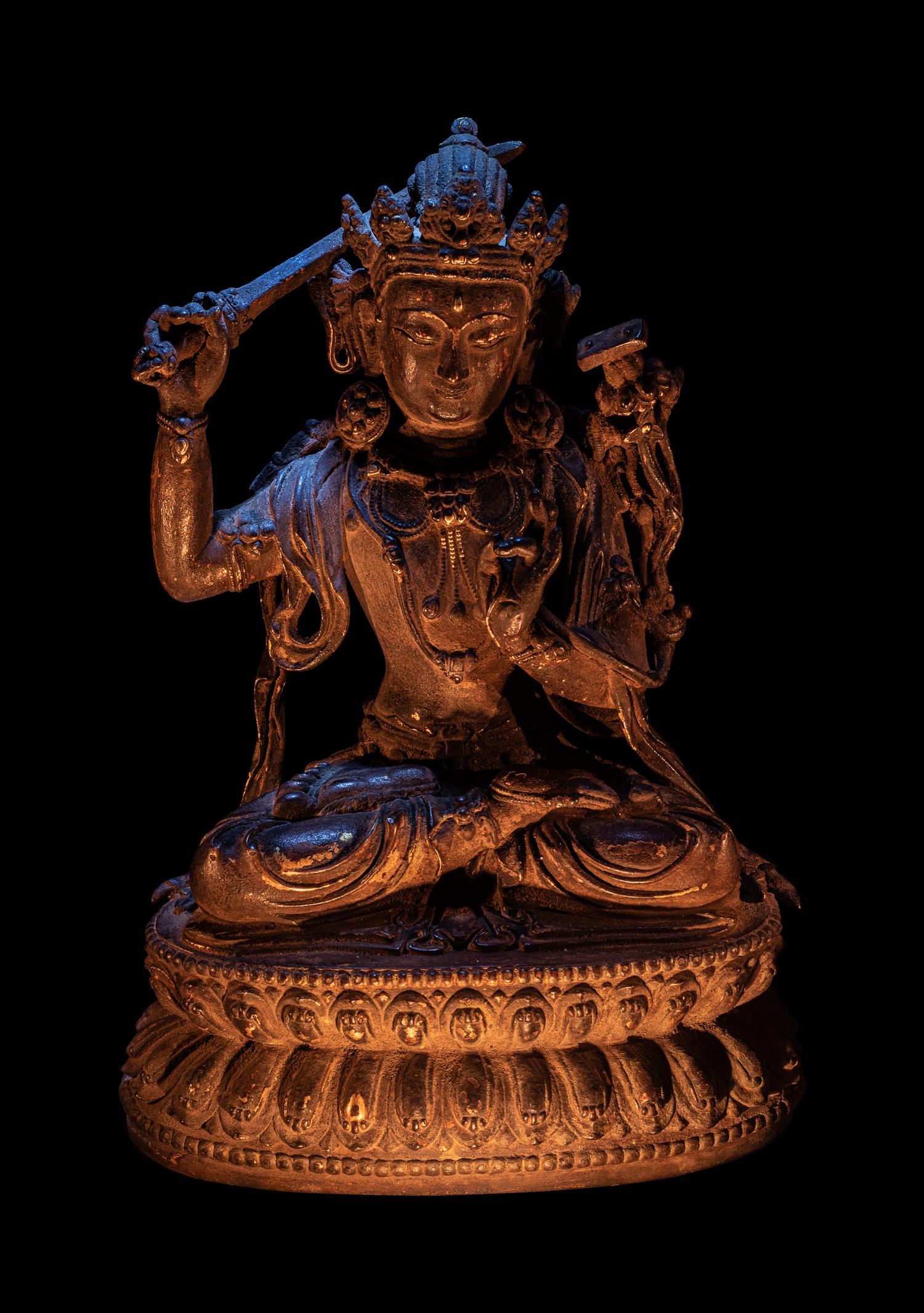 A Sino-Tibetan Parcel-Gilt Bronze Figure of Manjushri