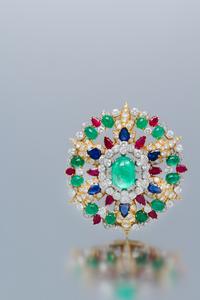 An 18 Karat Yellow Gold, Platinum, Emerald, Ruby, Sapphire and Diamond Pendant/Brooch, David Webb, Circa 1960, 33.10 dwts.