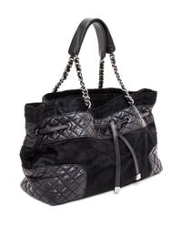 A Chanel Black Pony Hair Drawstring Tote Bag, 14" x 9" x 5".