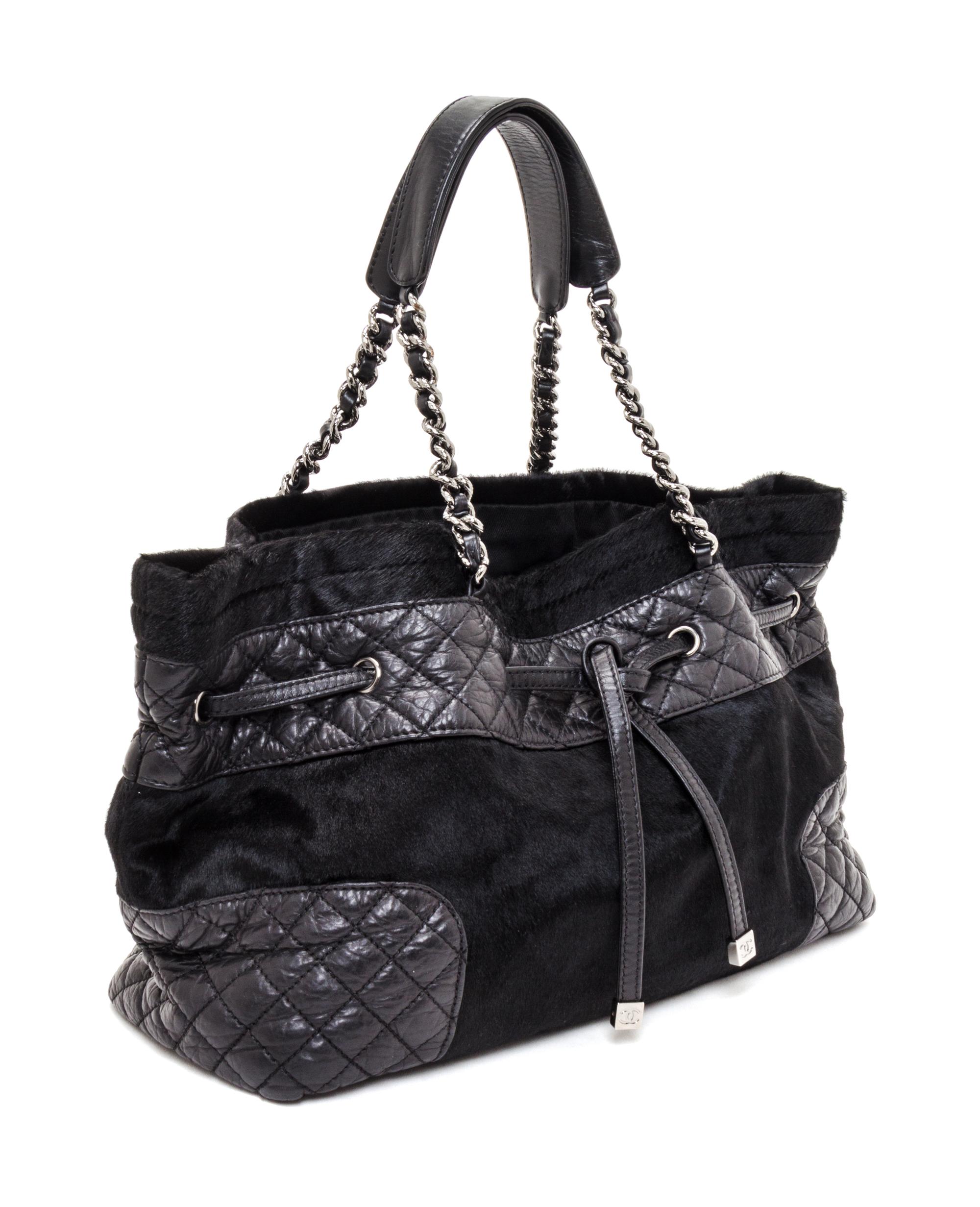 A Chanel Black Pony Hair Drawstring Tote Bag, 14" x 9" x 5".