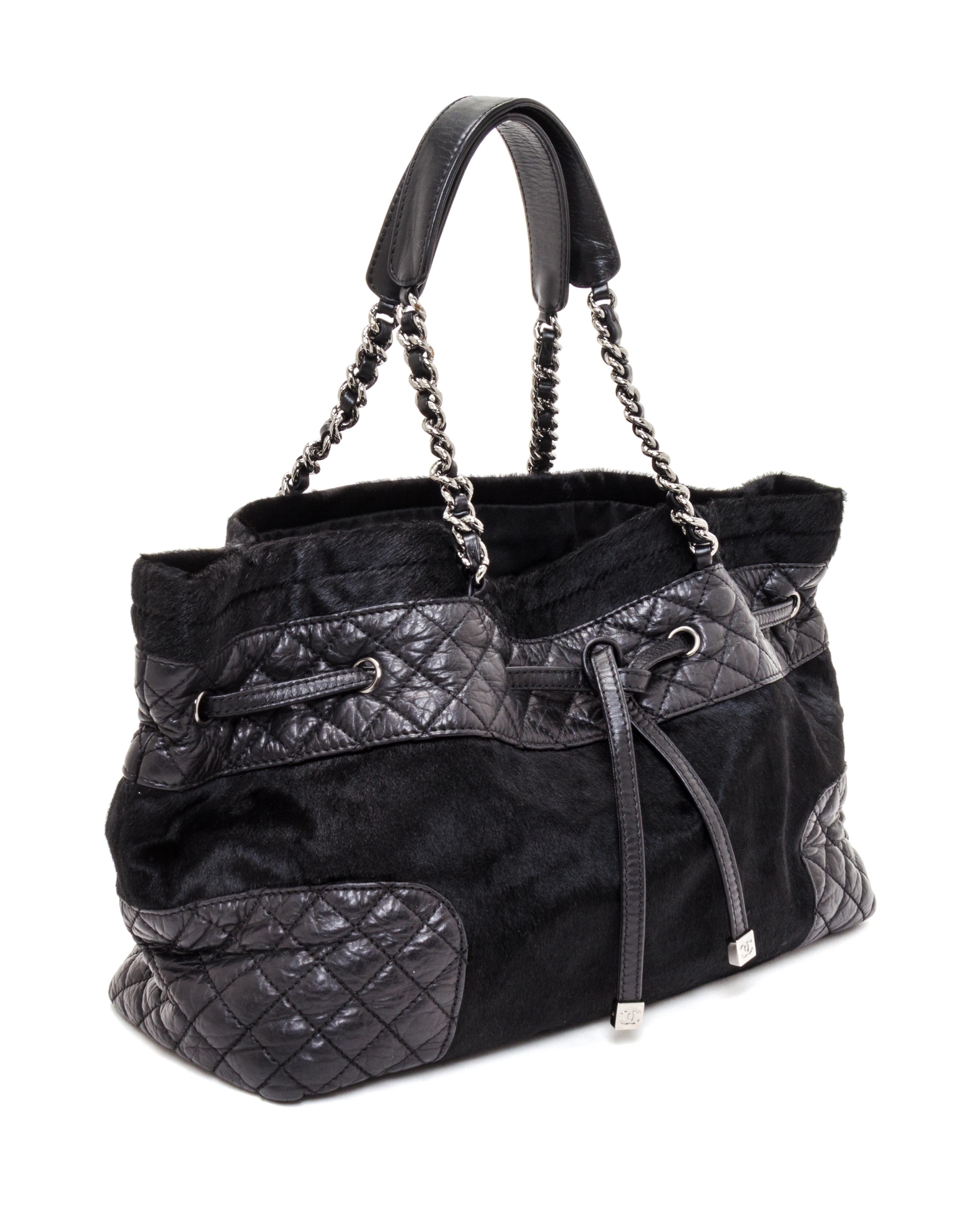 A Chanel Black Pony Hair Drawstring Tote Bag, 14" x 9" x 5".