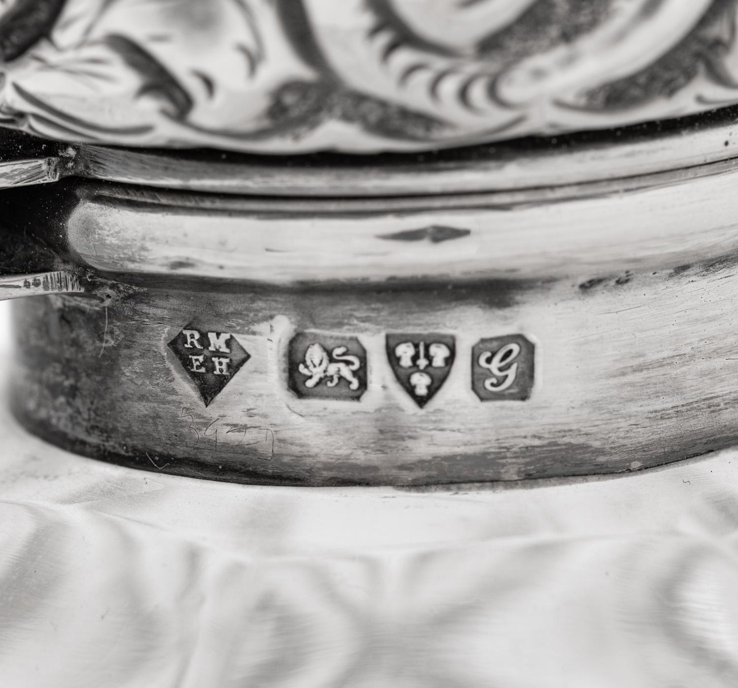 Four English Silver Mounted Cut Glass Bottles