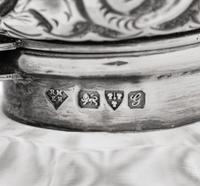 Four English Silver Mounted Cut Glass Bottles