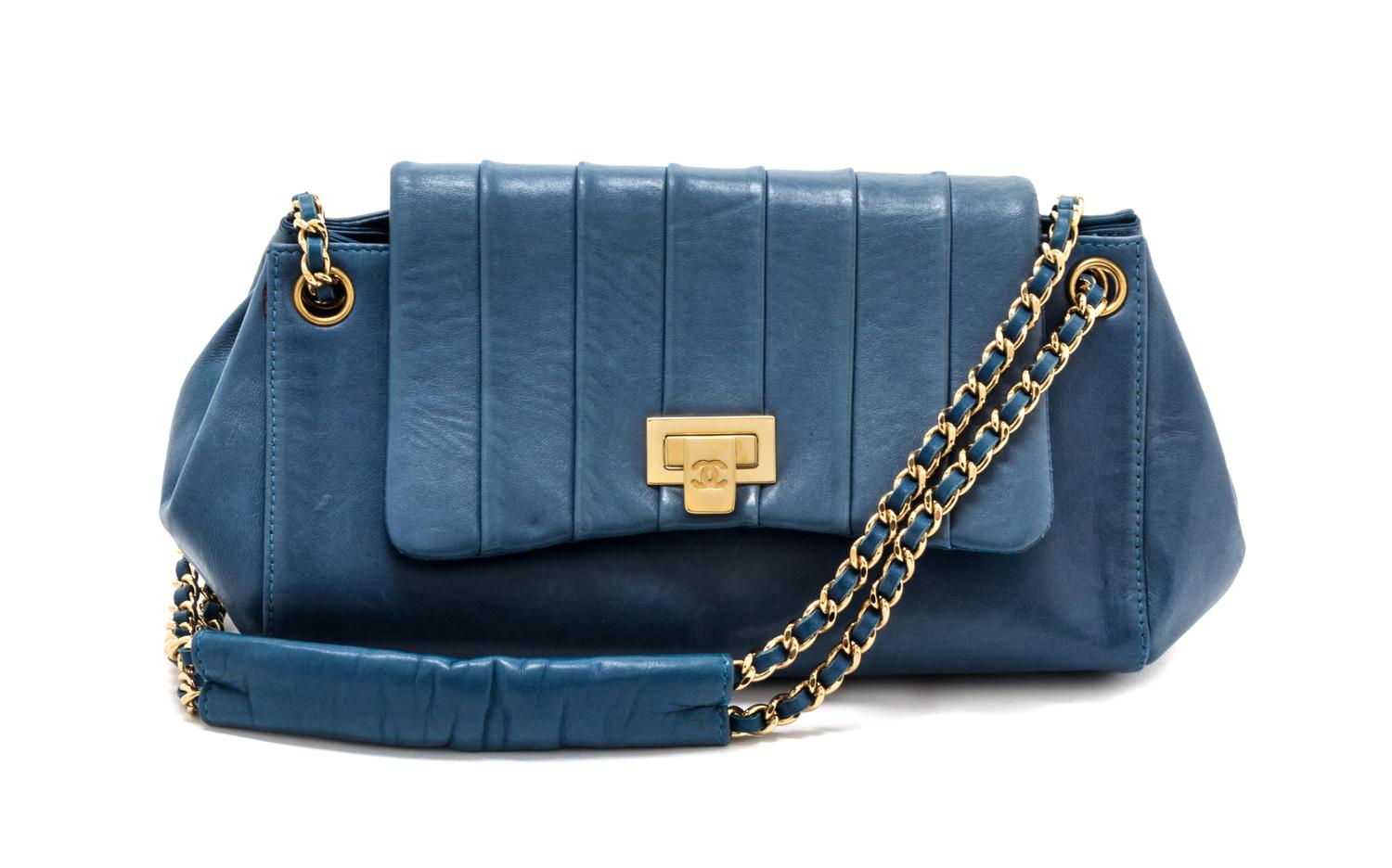 A Chanel Blue Calfskin Leather Accordian Flap Handbag, 9" x 5" x 4".