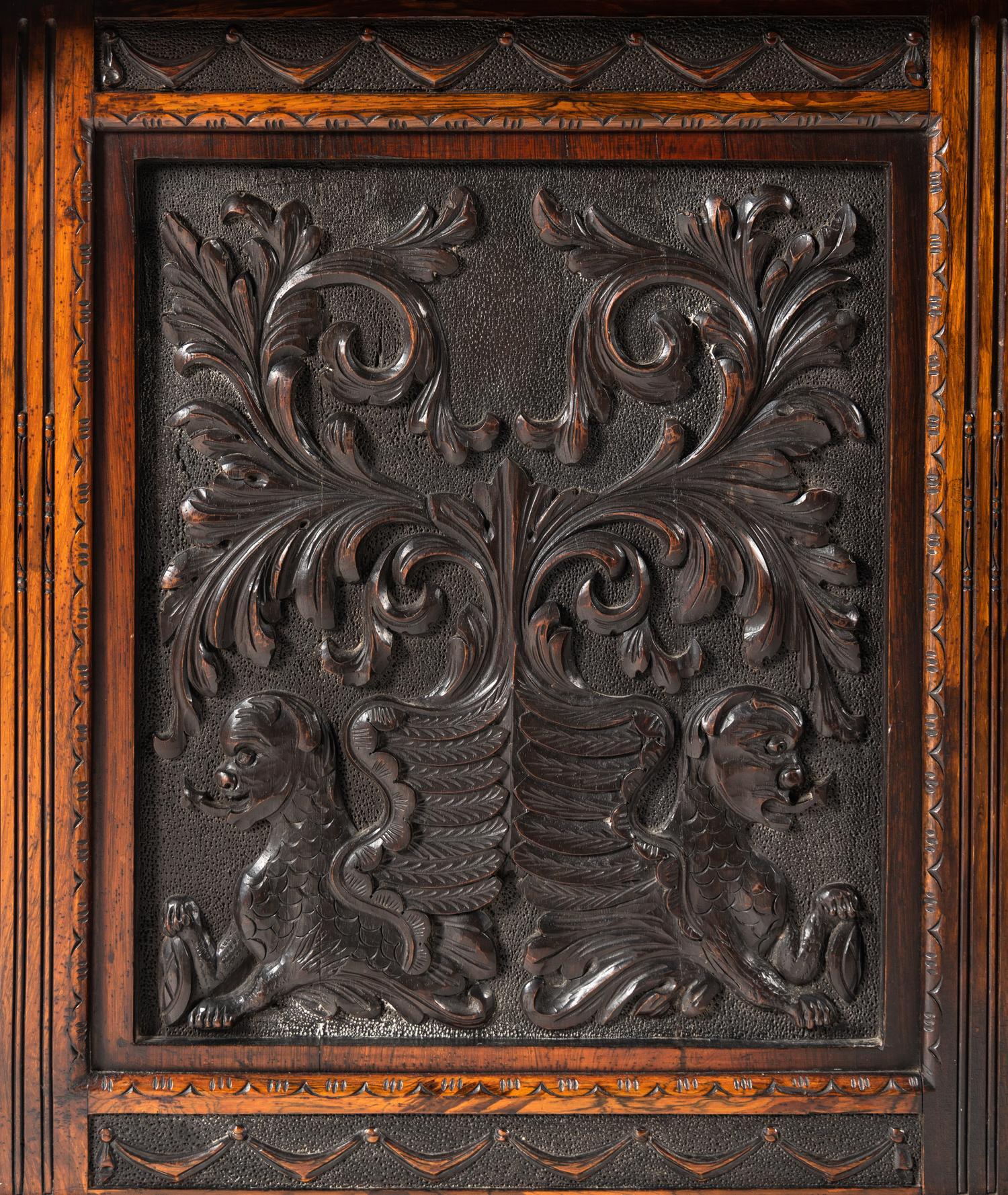 An Italian Rosewood and Carved Walnut Bookcase