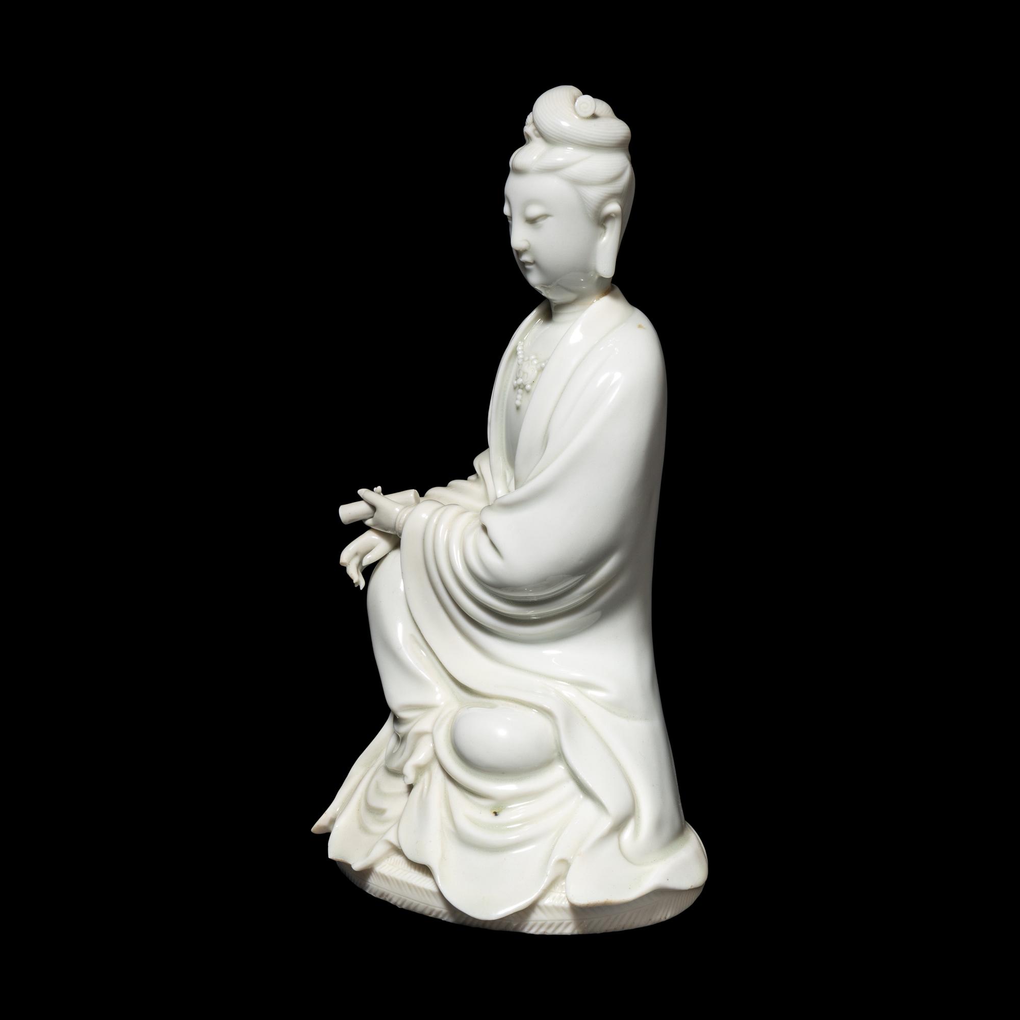 A Chinese Blanc-de-Chine Porcelain Figure of Guanyin, Late Qing/Republic Period 晚清/民國 德化白瓷書卷觀音