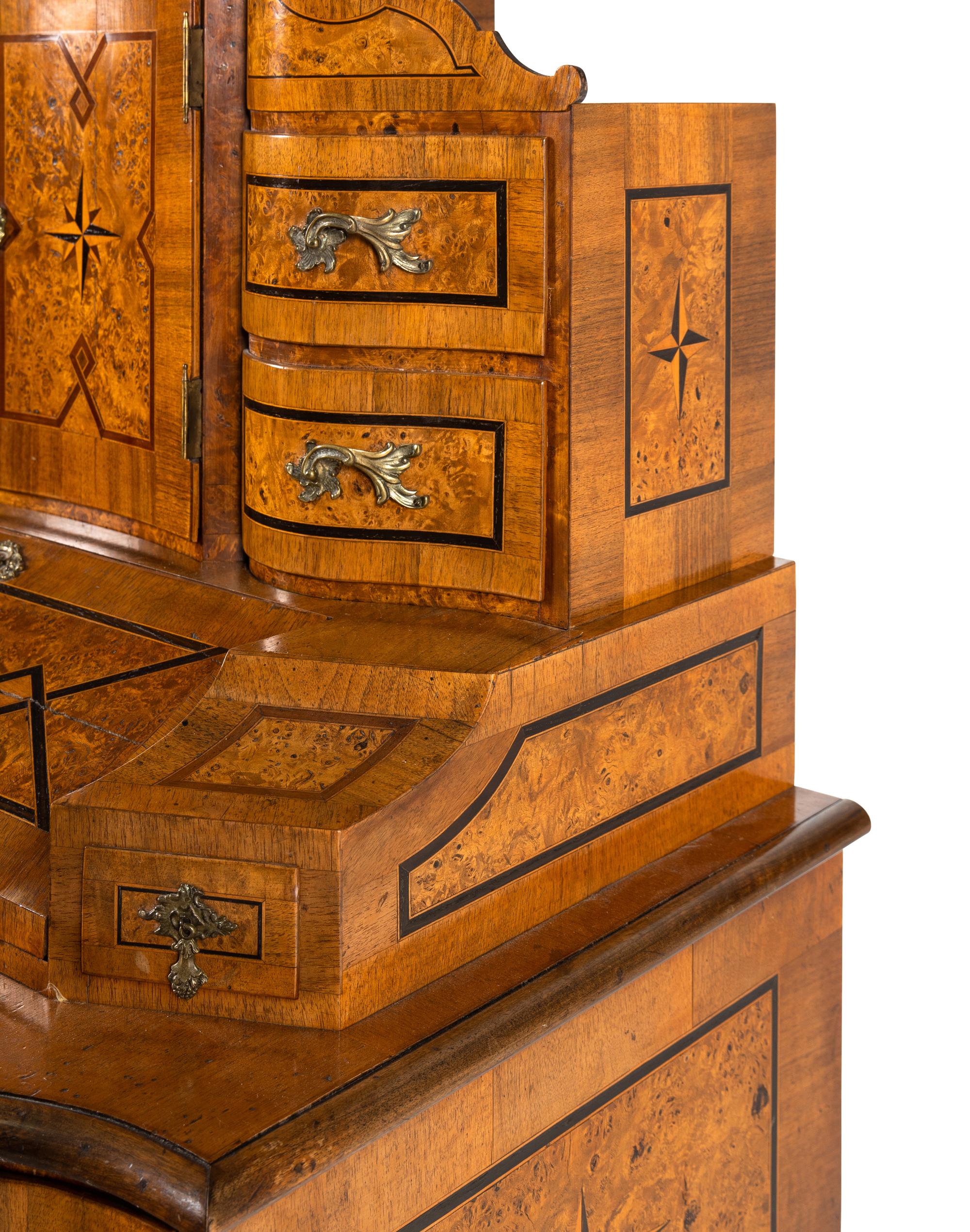 An Austrian Burlwood and Walnut Tabernacle Bureau