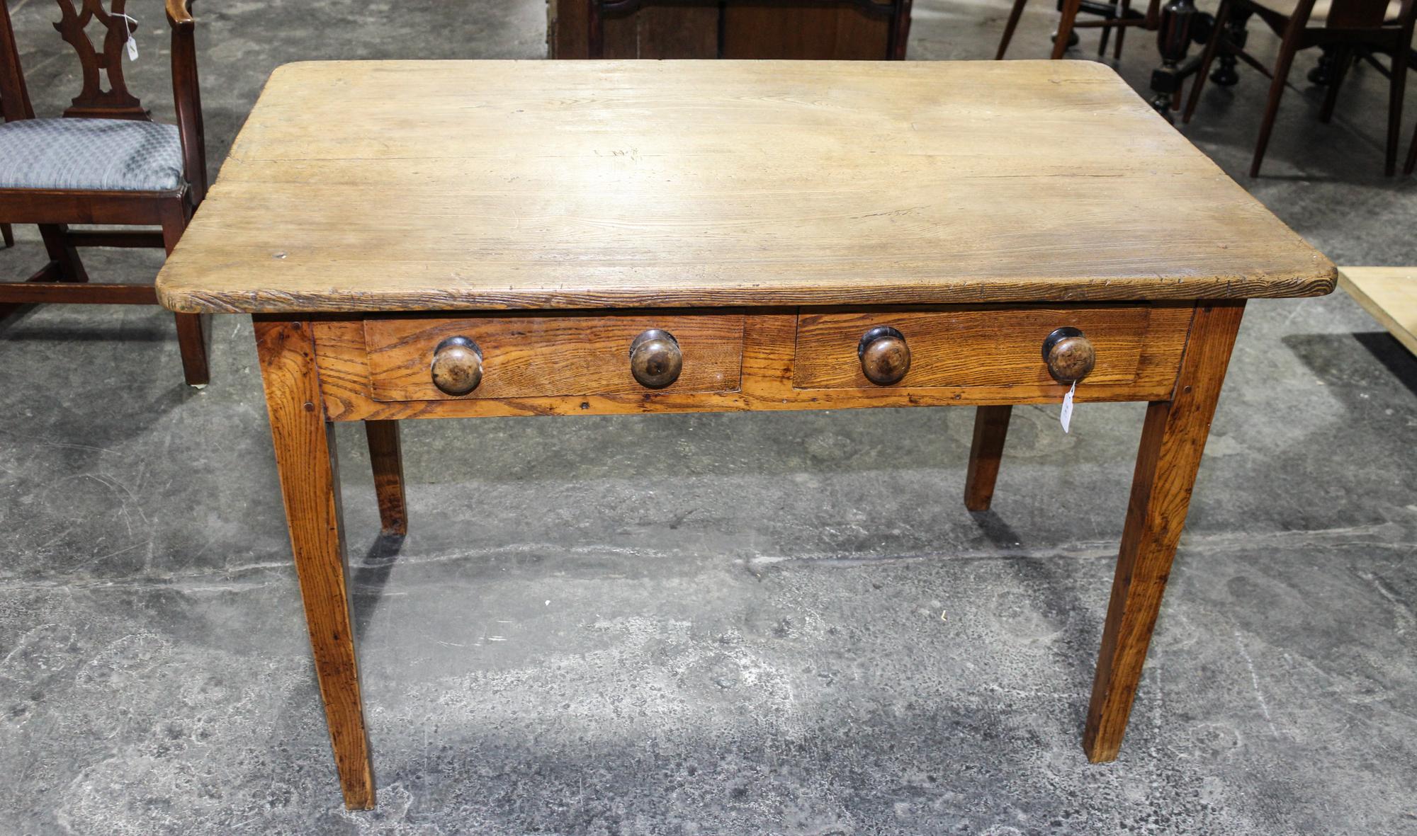 An American Walnut Worktable Height 29 1/2 x width 46 1/4 x depth 28 3/8 inches. — LATE 19TH/EARLY 20TH CENTURY