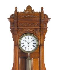 A Victorian Carved Oak Tall Case Clock