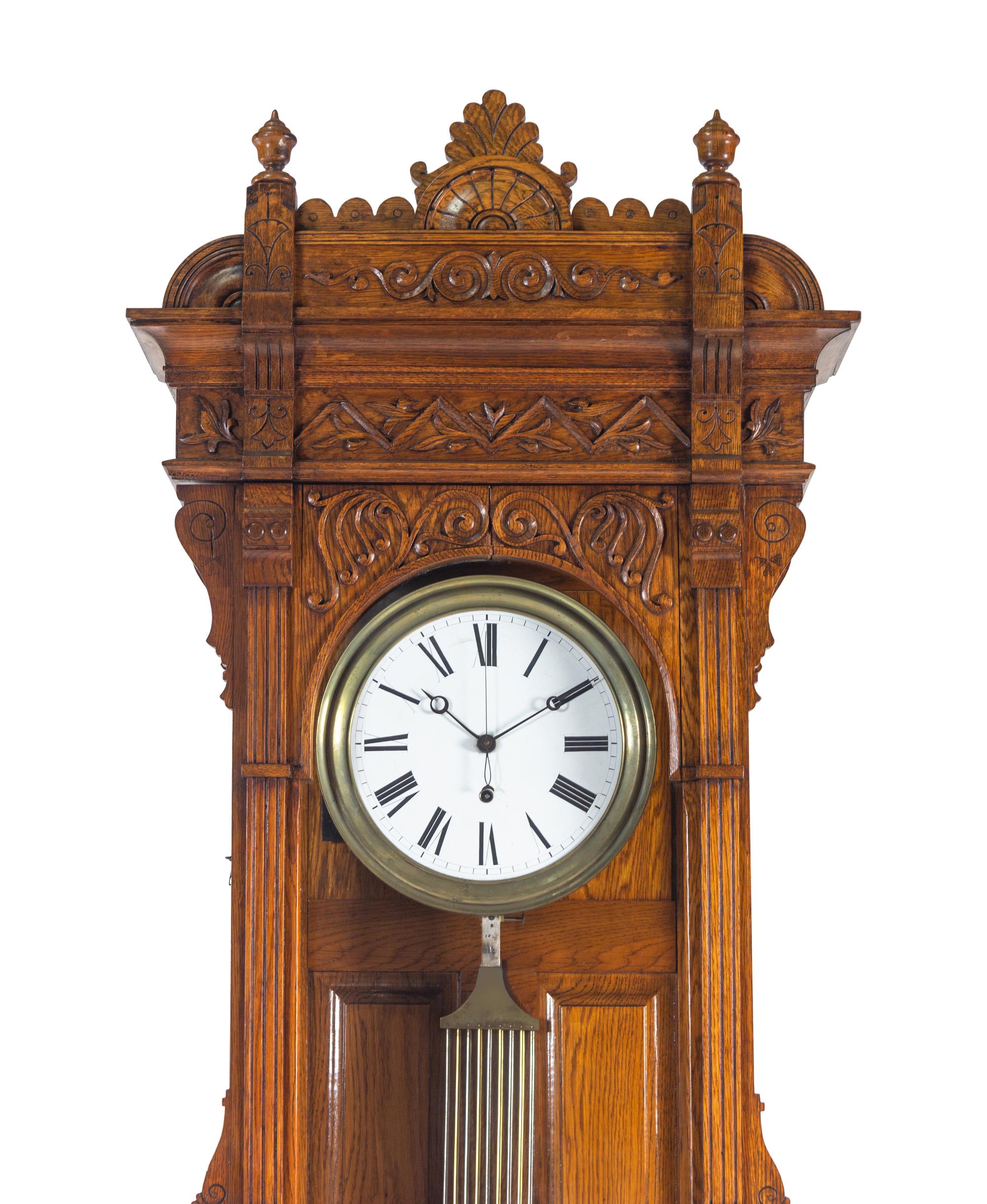 A Victorian Carved Oak Tall Case Clock