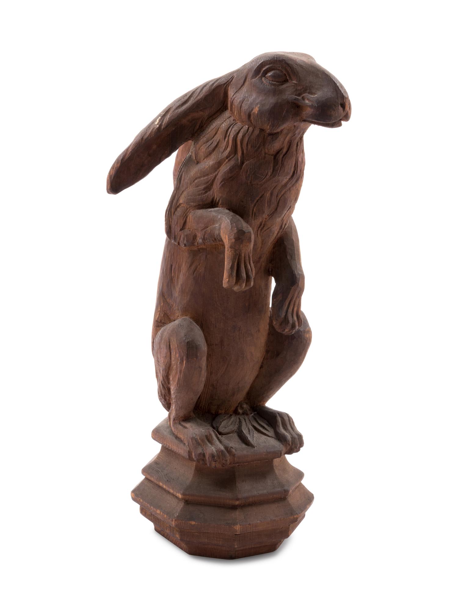 A Continental Carved Pine Figure of a Rabbit