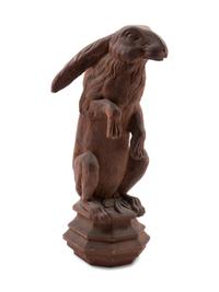A Continental Carved Pine Figure of a Rabbit