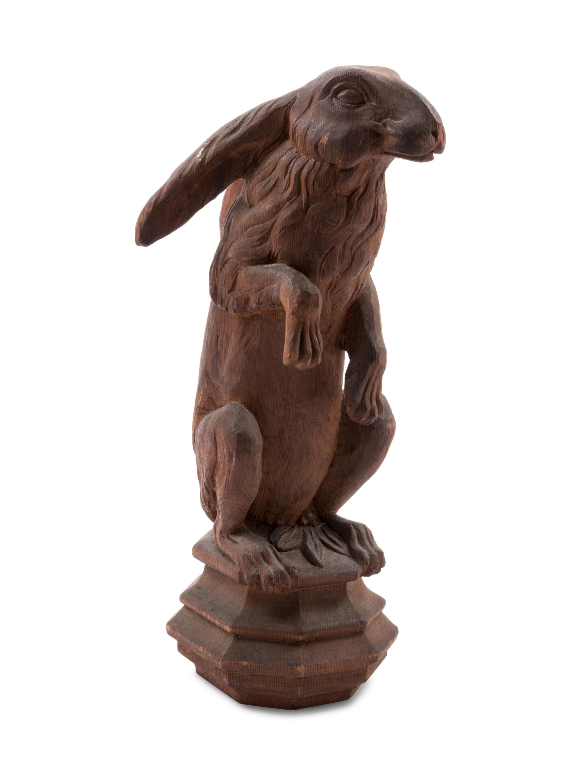 A Continental Carved Pine Figure of a Rabbit