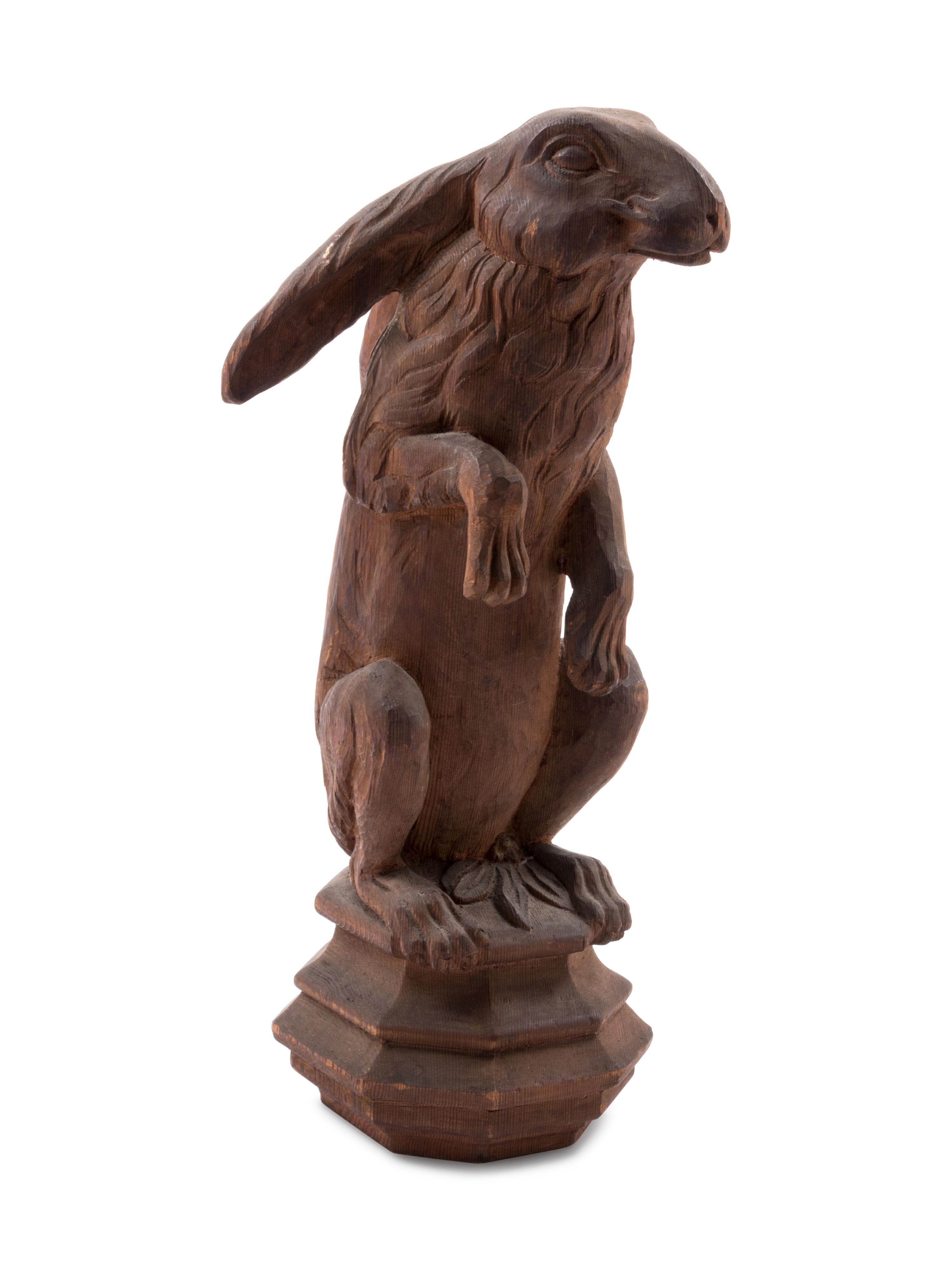 A Continental Carved Pine Figure of a Rabbit