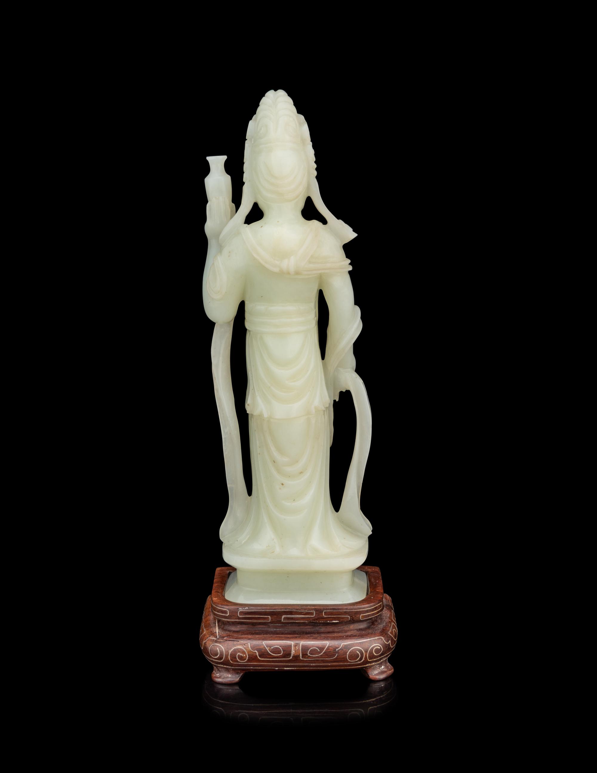 A Pale Celadon Jade Figure of Standing Guanyin