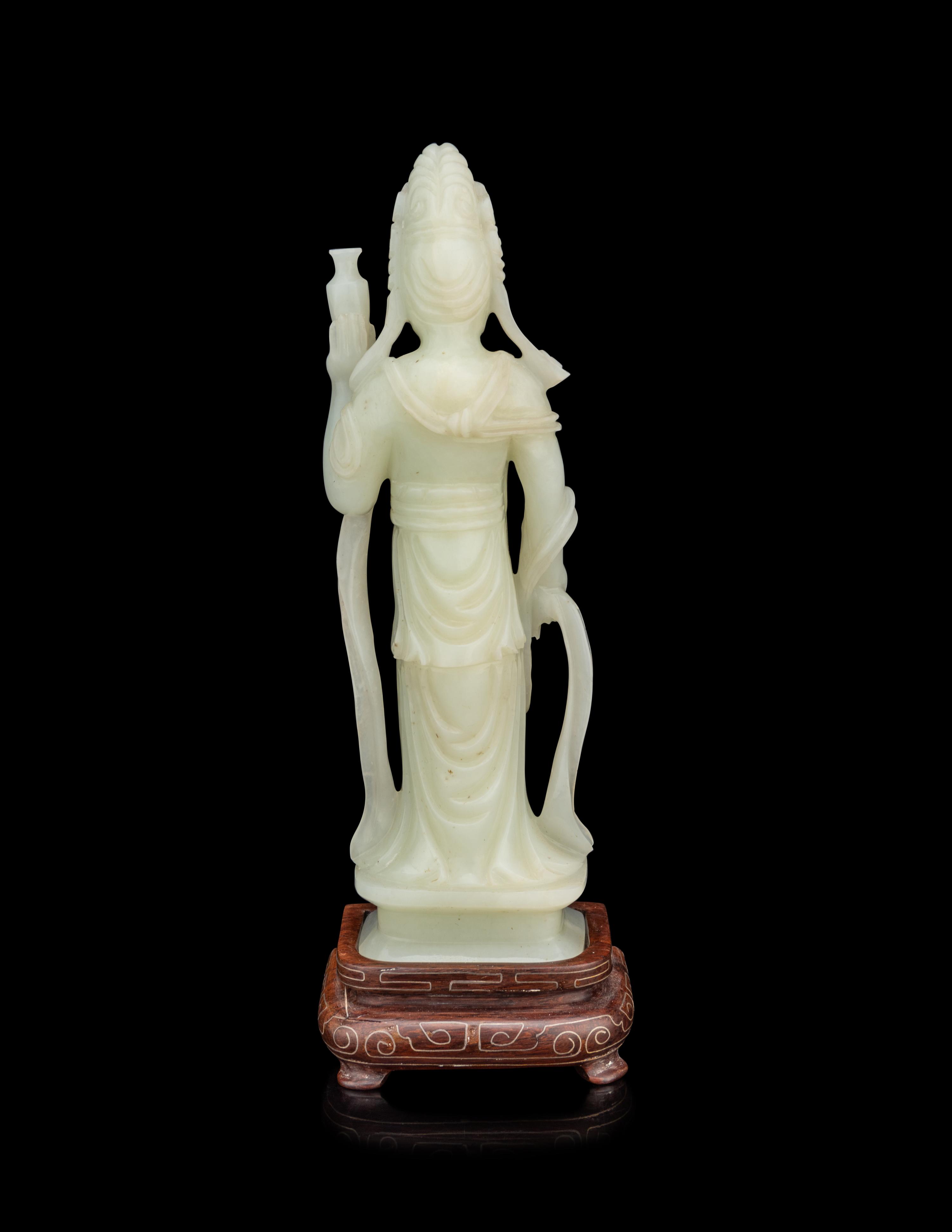 A Pale Celadon Jade Figure of Standing Guanyin