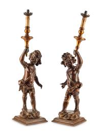 A Pair of Continental Carved Walnut Figures of Putti