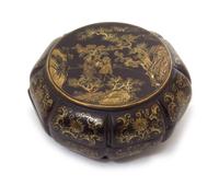 A Gilt Decorated Black Lacquer Box and Cover Diameter 5 1/2 inches.