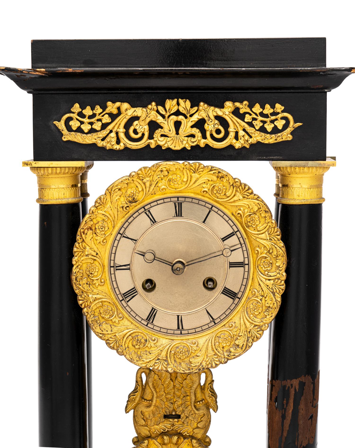A Charles X Gilt Bronze Mounted Ebonized Fruitwood Clock