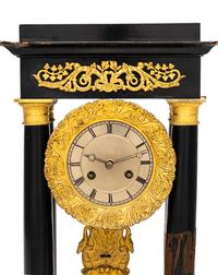 A Charles X Gilt Bronze Mounted Ebonized Fruitwood Clock