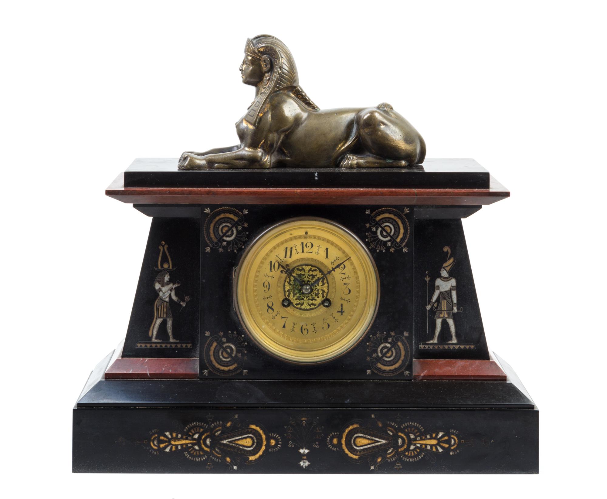 An Egyptian Revival Slate and Bronze Mantel Clock Height 16 x width 16 1/2 inches.