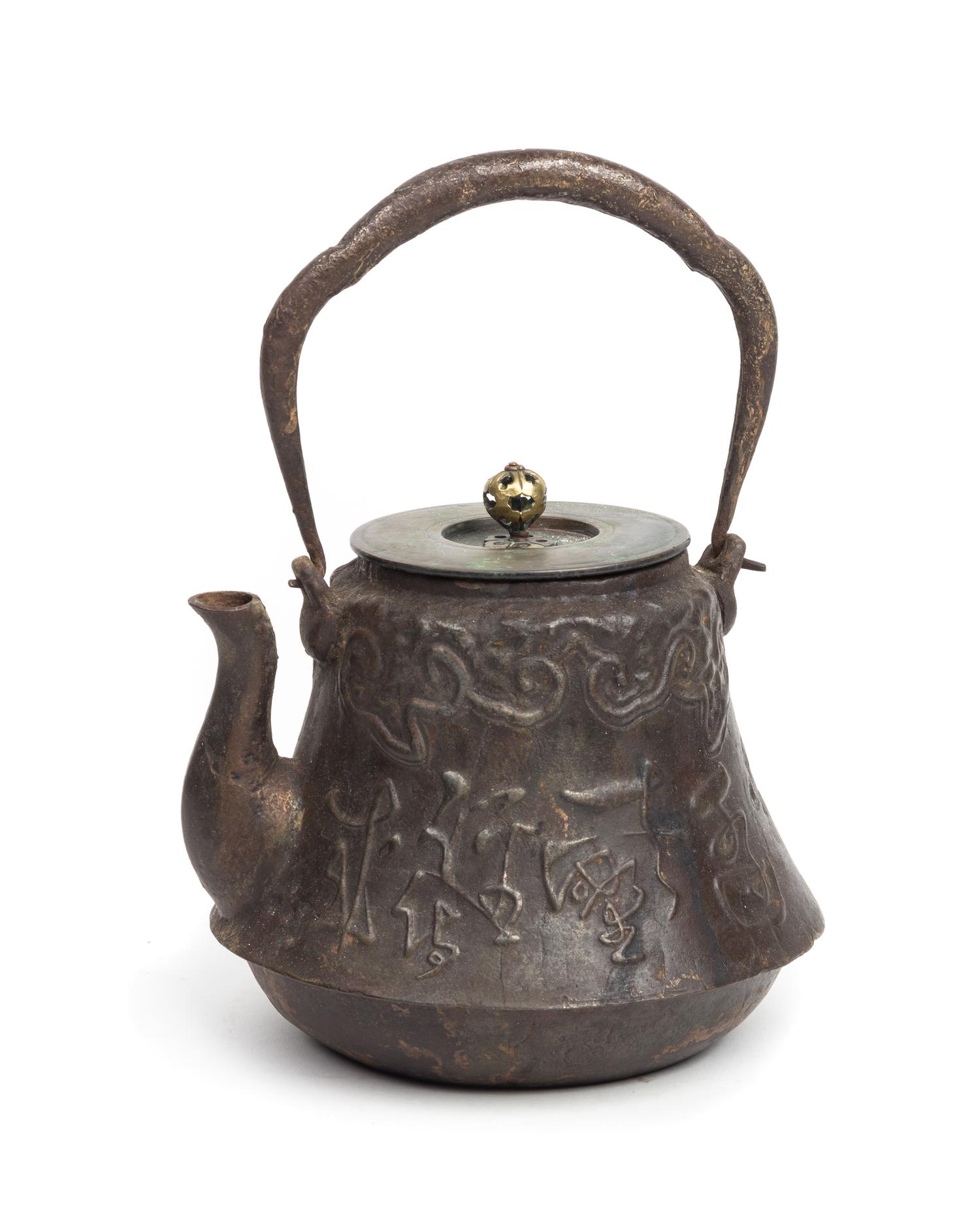 A Japanese Cast Iron Teapot, Tetsubin Height 9 1/2 inches. — 19TH CENTURY